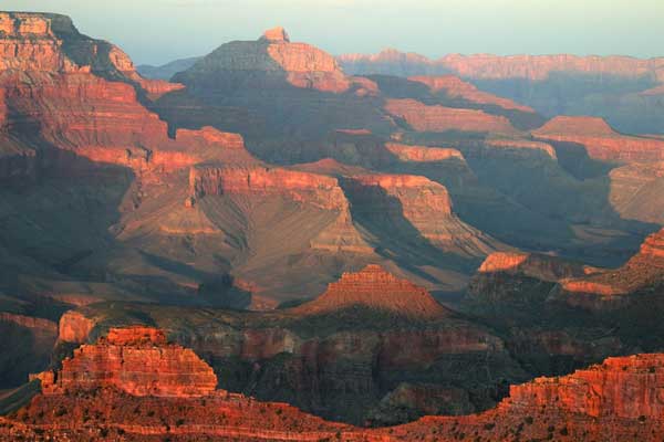 The Grand Canyon UNESCO World Heritage Site at sunset in Arizona, USA, colors of red and orange at sunset on the Grand Canyon